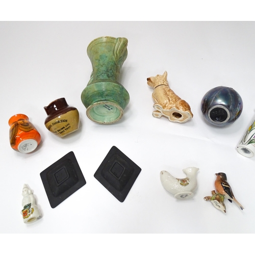 61 - A quantity of assorted ceramic wares to include a Beswick model of a Chaffinch, Poole pottery vases,... 