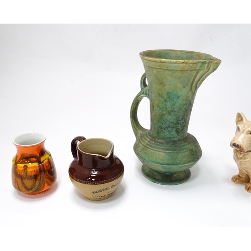 61 - A quantity of assorted ceramic wares to include a Beswick model of a Chaffinch, Poole pottery vases,... 