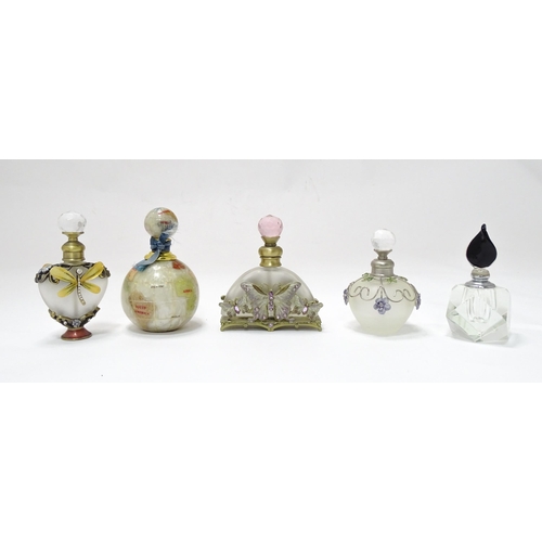 81 - Five assorted snuff bottles, one with globe detail. Largest approx. 3 3/4