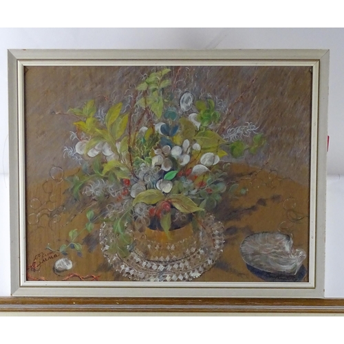 20 - Two 20thC pastels to include a lake landscape scene with trees, and a still life study with flowers ... 