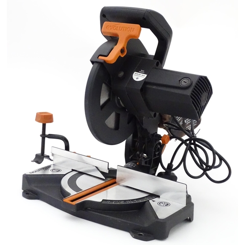 7 - Workshop tools : an Evolution R210 CMS chop saw, with manual and fitted blade. Approx 17