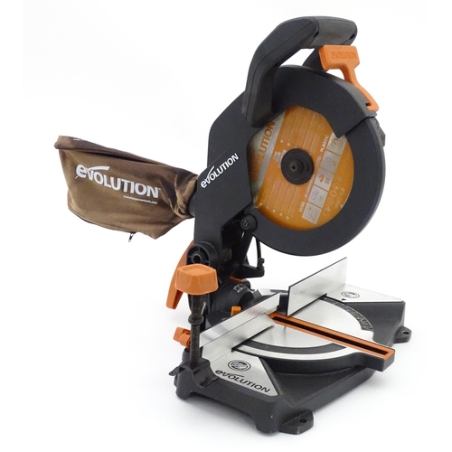 7 - Workshop tools : an Evolution R210 CMS chop saw, with manual and fitted blade. Approx 17