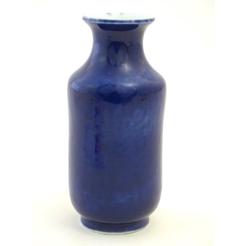 27 - A Chinese vase with a flared rim with a cobalt blue ground. Approx. 7 3/4