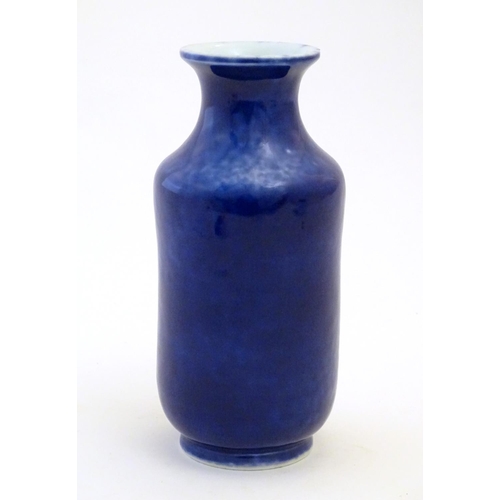 27 - A Chinese vase with a flared rim with a cobalt blue ground. Approx. 7 3/4