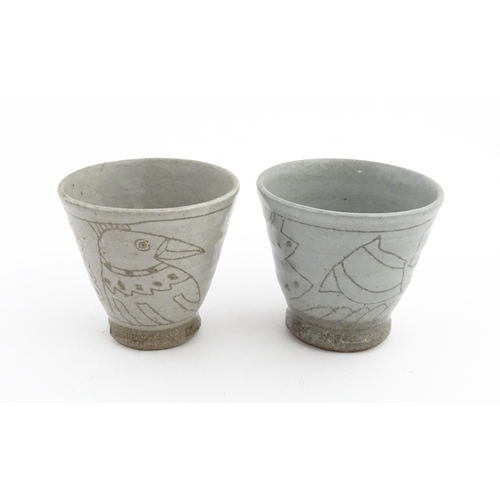 41 - Four items of Japanese studio pottery each with hand drawn decoration depicting mythical creatures. ... 