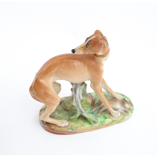 64 - A French model of a greyhound with a rabbit / hare, on a naturalistic oval base. In the manner of Ja... 