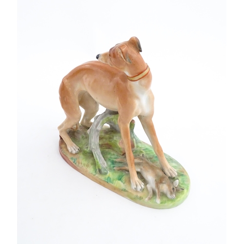 64 - A French model of a greyhound with a rabbit / hare, on a naturalistic oval base. In the manner of Ja... 