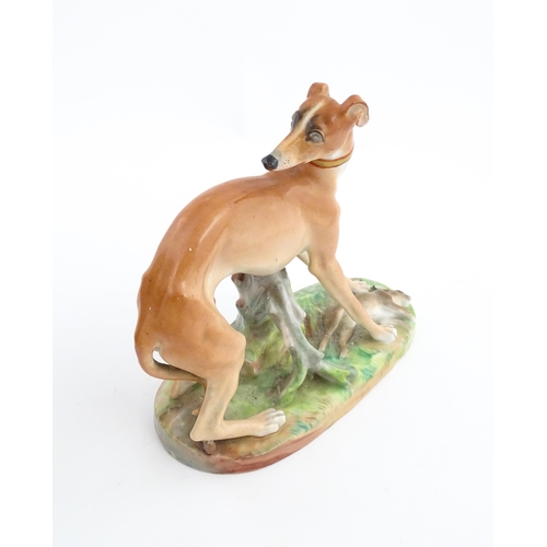 64 - A French model of a greyhound with a rabbit / hare, on a naturalistic oval base. In the manner of Ja... 