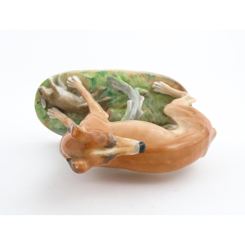 64 - A French model of a greyhound with a rabbit / hare, on a naturalistic oval base. In the manner of Ja... 