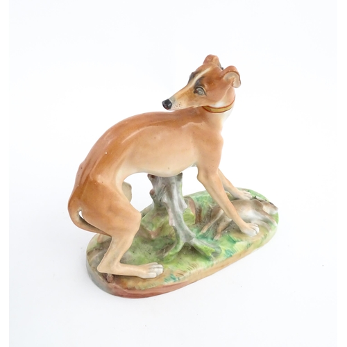 64 - A French model of a greyhound with a rabbit / hare, on a naturalistic oval base. In the manner of Ja... 