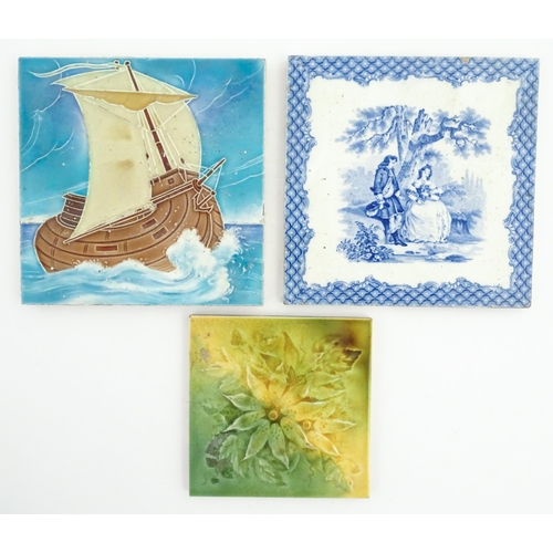 116 - Three assorted tiles to include a tubelined example depicting a ship at sea, a blue and white tile d... 