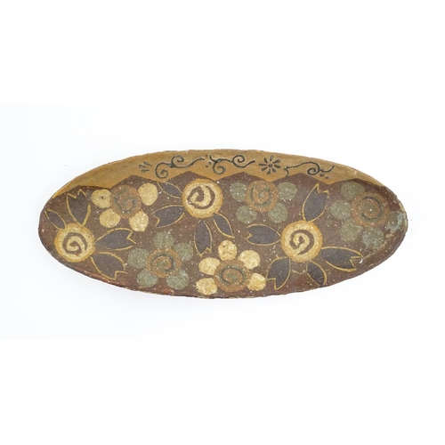 131 - A quantity of studio pottery wares to include a platter with hand painted fish decoration, a Contine... 