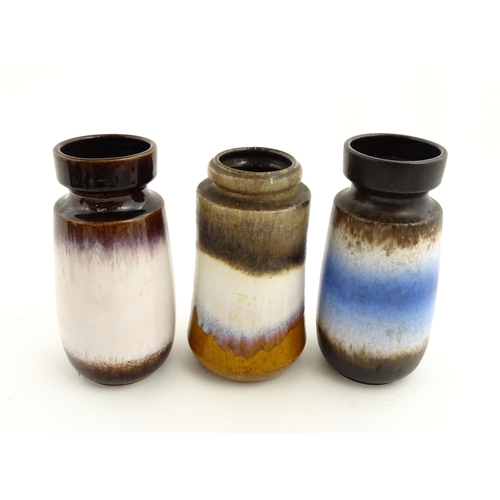 183 - Three West German Scheurich vases to include a brown glazed vase with central blue and white detail,... 