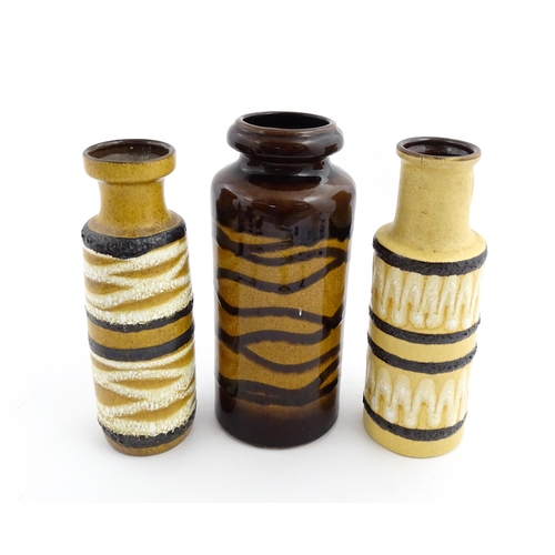 191 - Three West German Scheurich vases to include an example with a single loop handle, each decorated wi... 