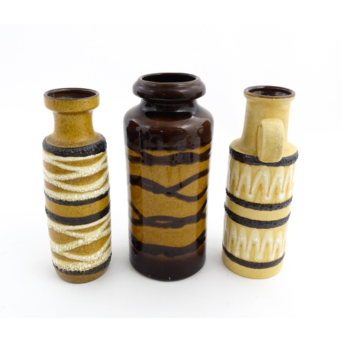 191 - Three West German Scheurich vases to include an example with a single loop handle, each decorated wi... 