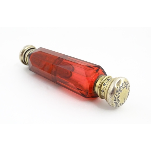 218 - A Victorian ruby glass double ended scent / salts flask. Approx. 4 3/4