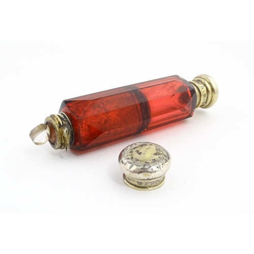 218 - A Victorian ruby glass double ended scent / salts flask. Approx. 4 3/4