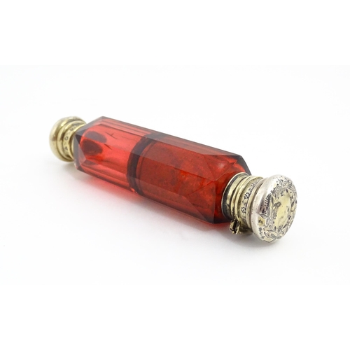 218 - A Victorian ruby glass double ended scent / salts flask. Approx. 4 3/4