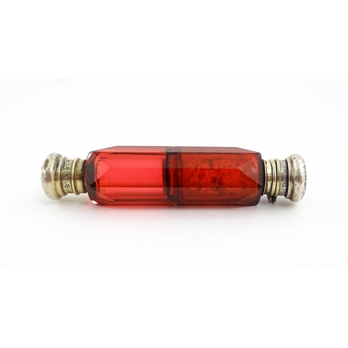 218 - A Victorian ruby glass double ended scent / salts flask. Approx. 4 3/4