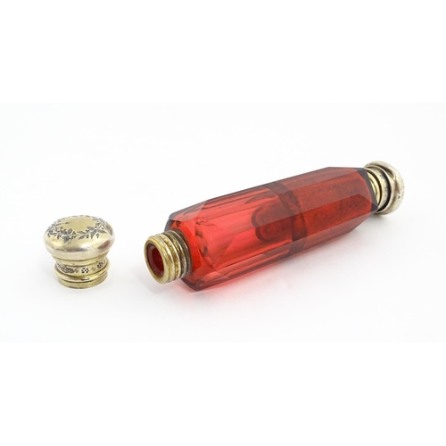 218 - A Victorian ruby glass double ended scent / salts flask. Approx. 4 3/4