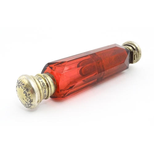 218 - A Victorian ruby glass double ended scent / salts flask. Approx. 4 3/4