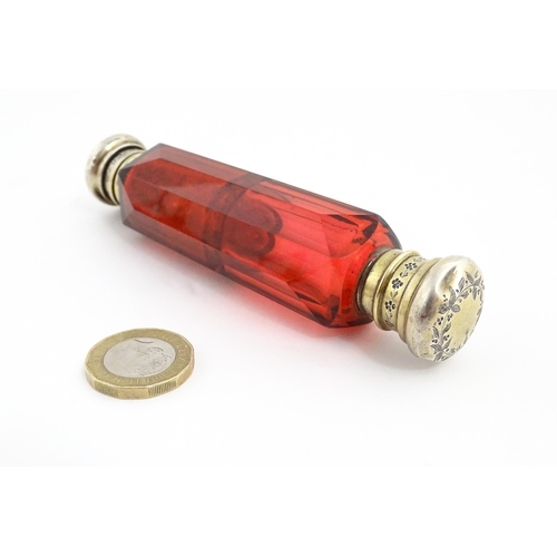 218 - A Victorian ruby glass double ended scent / salts flask. Approx. 4 3/4