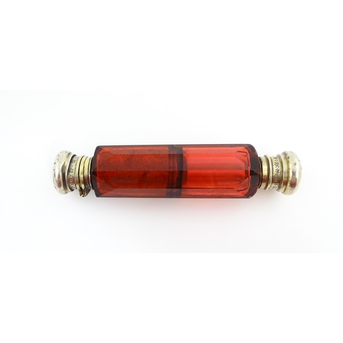 218 - A Victorian ruby glass double ended scent / salts flask. Approx. 4 3/4