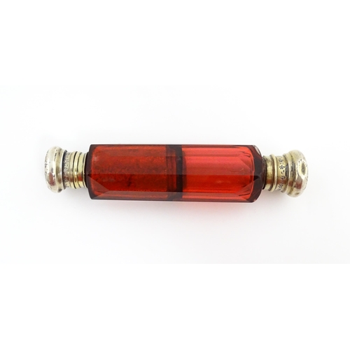 218 - A Victorian ruby glass double ended scent / salts flask. Approx. 4 3/4