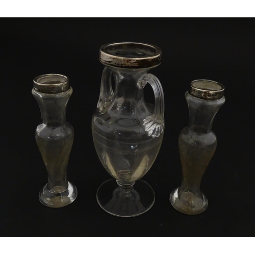 221 - A pair of glass bud vases with etched floral detail and silver rims hallmarked London 1901. Together... 