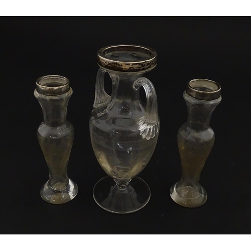 221 - A pair of glass bud vases with etched floral detail and silver rims hallmarked London 1901. Together... 