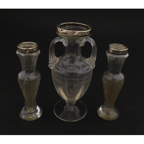 221 - A pair of glass bud vases with etched floral detail and silver rims hallmarked London 1901. Together... 