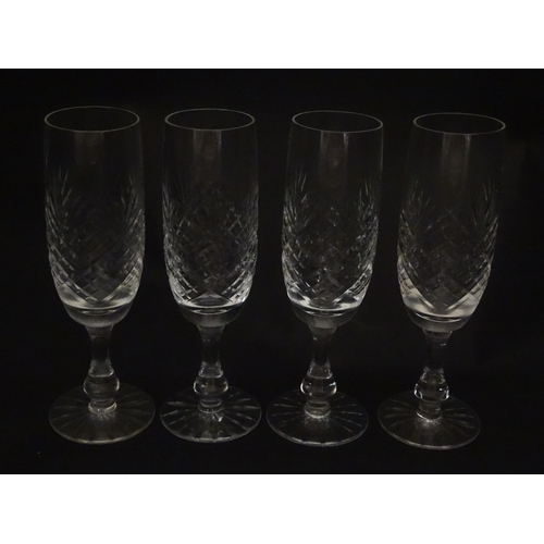 229 - A quantity of cut glass champagne flutes. Approx. 7 1/2