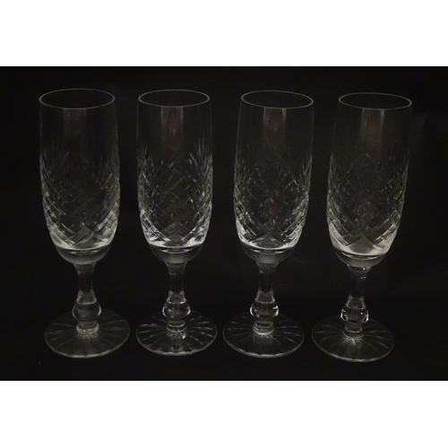 229 - A quantity of cut glass champagne flutes. Approx. 7 1/2