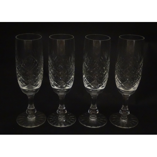 229 - A quantity of cut glass champagne flutes. Approx. 7 1/2