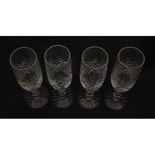 229 - A quantity of cut glass champagne flutes. Approx. 7 1/2