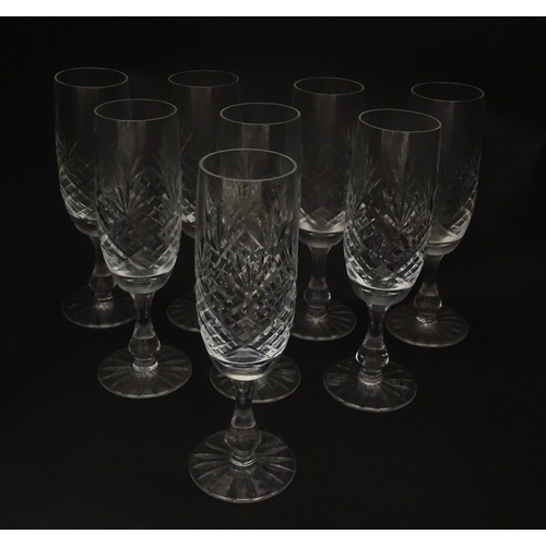 229 - A quantity of cut glass champagne flutes. Approx. 7 1/2