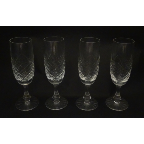 229 - A quantity of cut glass champagne flutes. Approx. 7 1/2