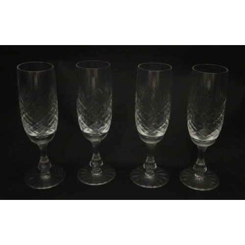 229 - A quantity of cut glass champagne flutes. Approx. 7 1/2