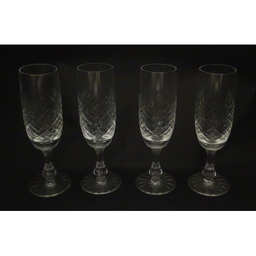 229 - A quantity of cut glass champagne flutes. Approx. 7 1/2