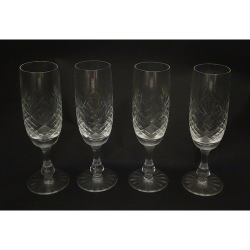 229 - A quantity of cut glass champagne flutes. Approx. 7 1/2