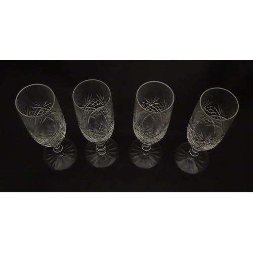 229 - A quantity of cut glass champagne flutes. Approx. 7 1/2