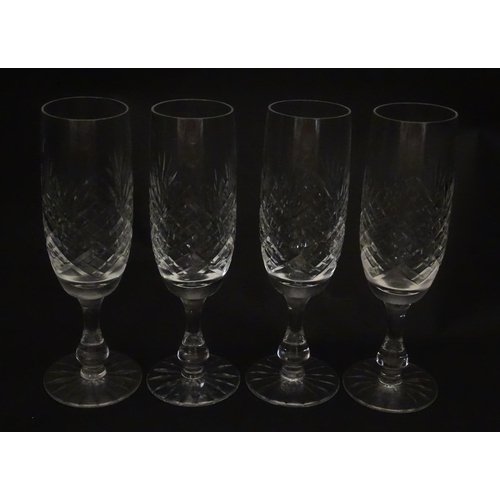 229 - A quantity of cut glass champagne flutes. Approx. 7 1/2