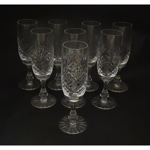 229 - A quantity of cut glass champagne flutes. Approx. 7 1/2