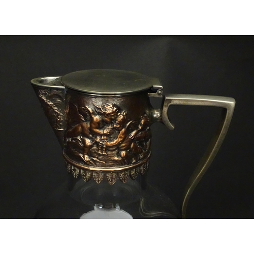 239 - An early 20thC glass claret jug with silver plate mount and handle depicting Bacchanalian figures. A... 