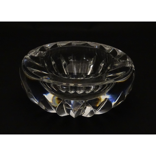 244 - A Baccarat ashtray of circular form. Marked under Baccarat France. Approx. 4 1/4