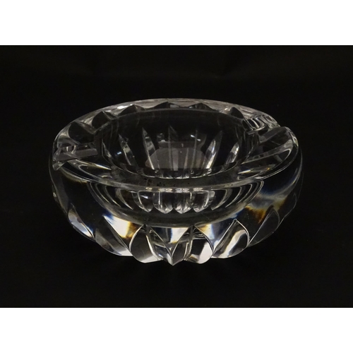 244 - A Baccarat ashtray of circular form. Marked under Baccarat France. Approx. 4 1/4