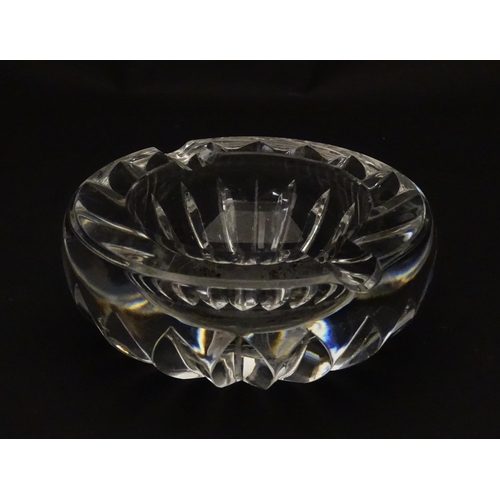 244 - A Baccarat ashtray of circular form. Marked under Baccarat France. Approx. 4 1/4