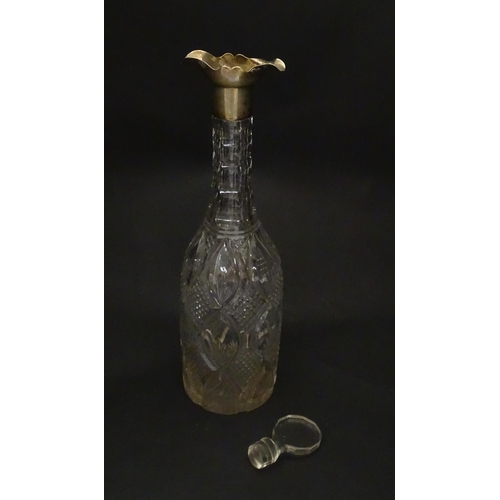 245 - A cut glass decanter of bottle form with silver mount hallmarked Birmingham 1919, maker Mappin & Web... 