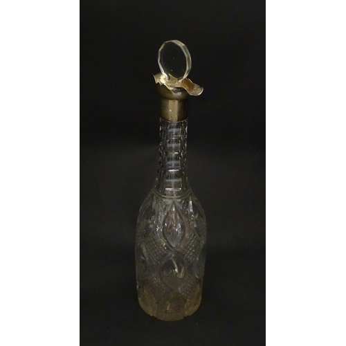 245 - A cut glass decanter of bottle form with silver mount hallmarked Birmingham 1919, maker Mappin & Web... 