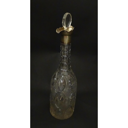 245 - A cut glass decanter of bottle form with silver mount hallmarked Birmingham 1919, maker Mappin & Web... 